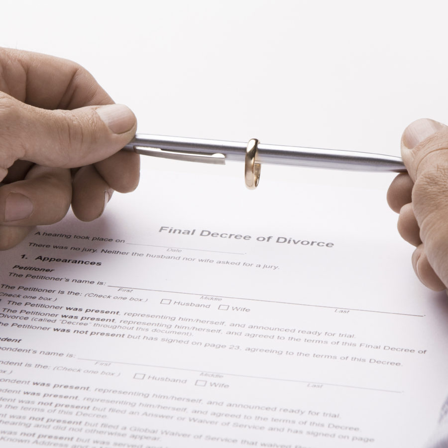 Husband signing decree of divorce, dissolution, canceling marriage, legal separation documents, wide panorama
